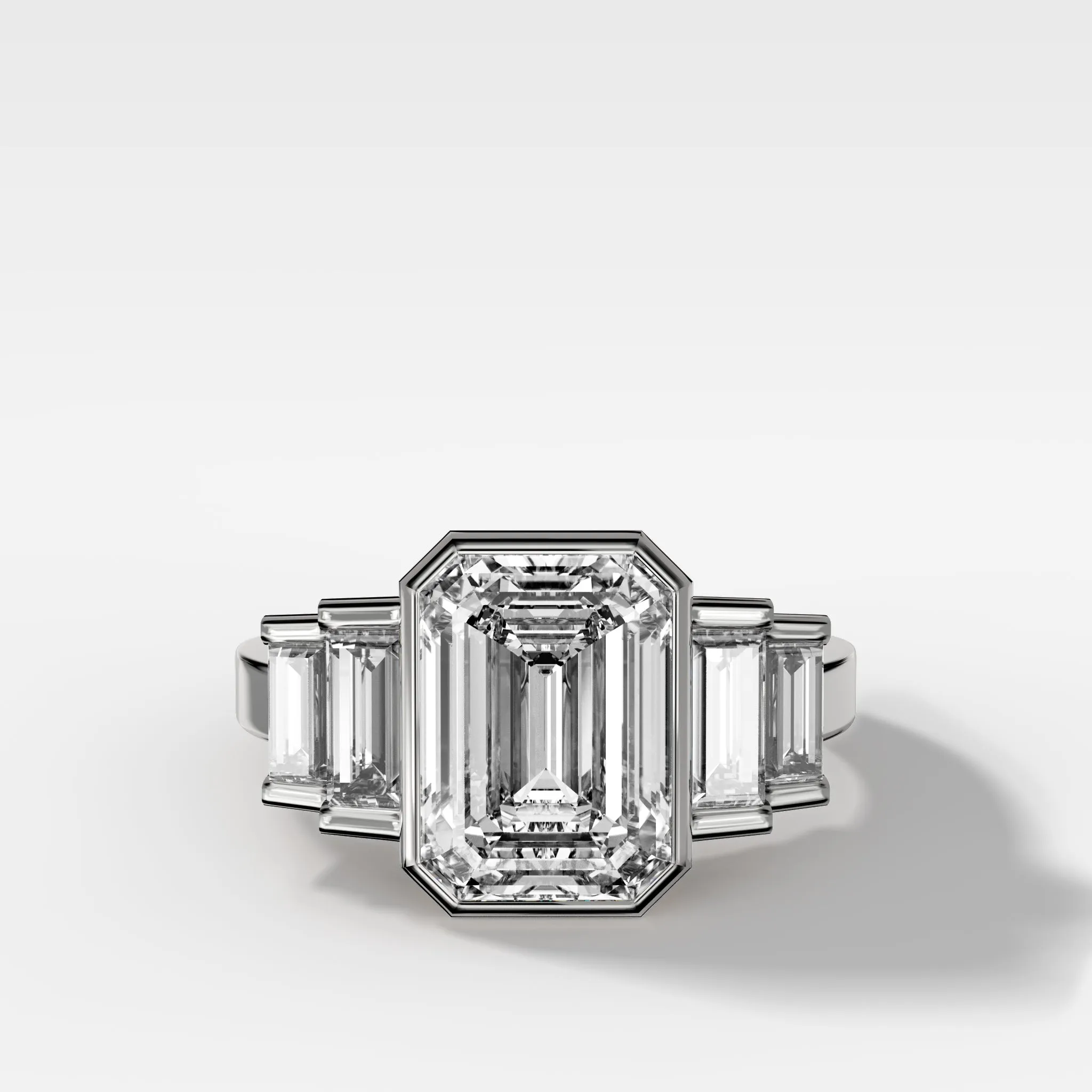 Five Stone Engagement Ring with Half Bezel Baguette Side Stones and Bezel Set Emerald Cut Diamond
